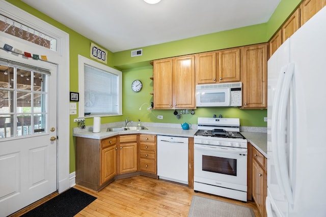 3300 Grove Ave Unit 3S, Berwyn, IL 60402 - kitchen with white appliances, light countertops, light wood-style flooring, and a sink
