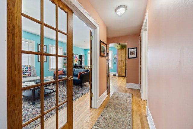 3300 Grove Ave Unit 3S, Berwyn, IL 60402 - hallway with light wood-style flooring, baseboards, and french doors