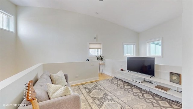 1508 Elmwood Ave Unit 3, Evanston, IL 60201 - living area featuring lofted ceiling, baseboards, and wood finished floors