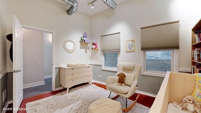 1508 Elmwood Ave Unit 3, Evanston, IL 60201 - living area with baseboards, wood finished floors, and track lighting