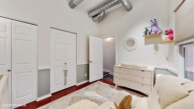1508 Elmwood Ave Unit 3, Evanston, IL 60201 - bedroom featuring two closets, dark wood-type flooring, and a high ceiling