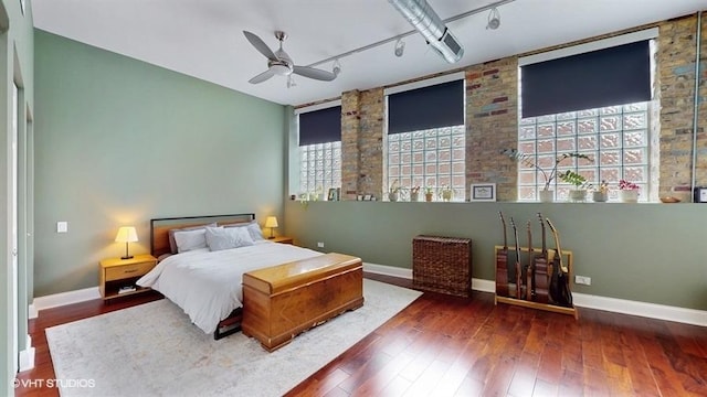1508 Elmwood Ave Unit 3, Evanston, IL 60201 - bedroom featuring track lighting, baseboards, and wood-type flooring