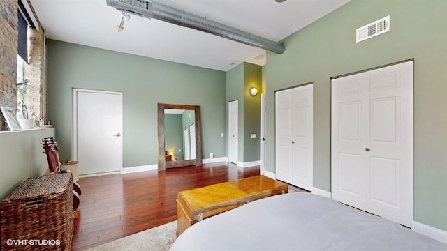 1508 Elmwood Ave Unit 3, Evanston, IL 60201 - bedroom featuring wood finished floors, multiple closets, and baseboards