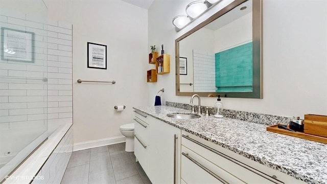 1508 Elmwood Ave Unit 3, Evanston, IL 60201 - bathroom featuring baseboards, toilet, vanity, and tile patterned floors