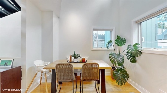 1508 Elmwood Ave Unit 3, Evanston, IL 60201 - dining room featuring baseboards and light wood-type flooring
