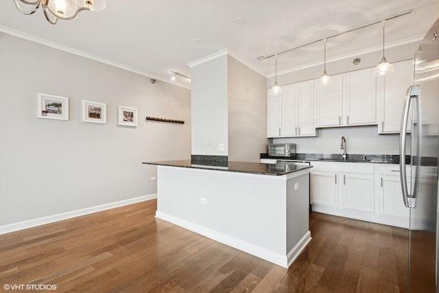 421 W Huron St Unit 1503, Chicago, IL 60654 - kitchen featuring ornamental molding, a sink, stainless steel appliances, white cabinets, and dark wood-type flooring