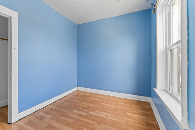 4947 W Huron St, Chicago, IL 60644 - unfurnished bedroom with light wood finished floors and baseboards