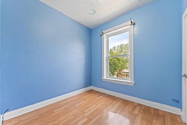 4947 W Huron St, Chicago, IL 60644 - unfurnished room featuring wood finished floors and baseboards