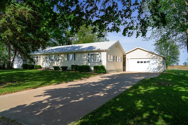 2056 Peek Home Rd, Dixon, IL 61021 - ranch-style home with a garage, an outdoor structure, a front yard, and concrete driveway