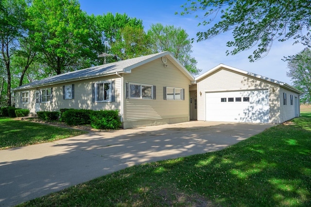 2056 Peek Home Rd, Dixon, IL 61021 - ranch-style home featuring an outdoor structure, concrete driveway, a front lawn, and a garage