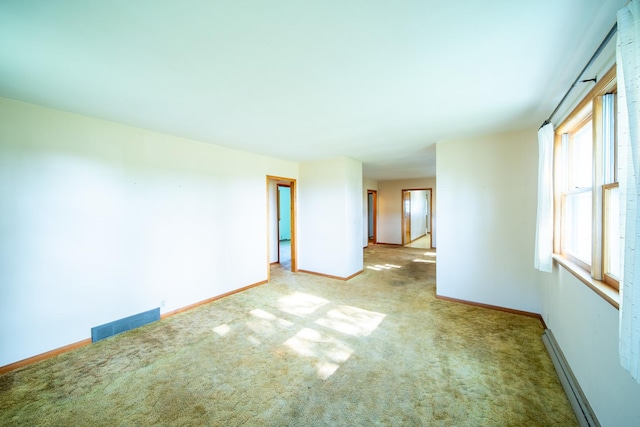 2056 Peek Home Rd, Dixon, IL 61021 - carpeted empty room with baseboards and a baseboard radiator