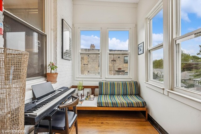 4940 N Ridgeway Ave Unit 3, Chicago, IL 60625 - sunroom / solarium with wood finished floors and baseboards