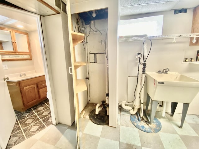 664 E 163rd St, South Holland, IL 60473 - bathroom featuring tile patterned floors and a sink