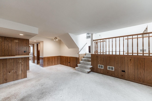 18207 Ohio Ct, Orland Park, IL 60467 - unfurnished living room featuring wooden walls, carpet floors, wainscoting, and stairway