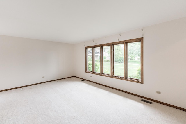 18207 Ohio Ct, Orland Park, IL 60467 - unfurnished room with baseboards and light carpet