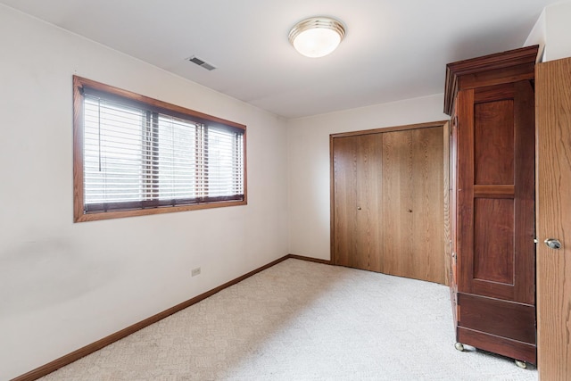 18207 Ohio Ct, Orland Park, IL 60467 - unfurnished bedroom featuring light colored carpet, a closet, and baseboards