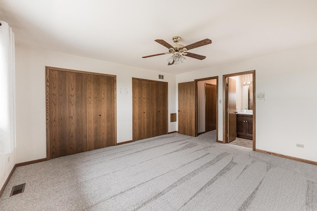 18207 Ohio Ct, Orland Park, IL 60467 - unfurnished bedroom featuring two closets, light colored carpet, baseboards, and a ceiling fan
