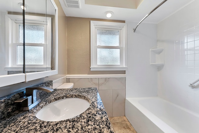 128 8th St, Downers Grove, IL 60515 - bathroom with tile walls, bathtub / shower combination, and vanity