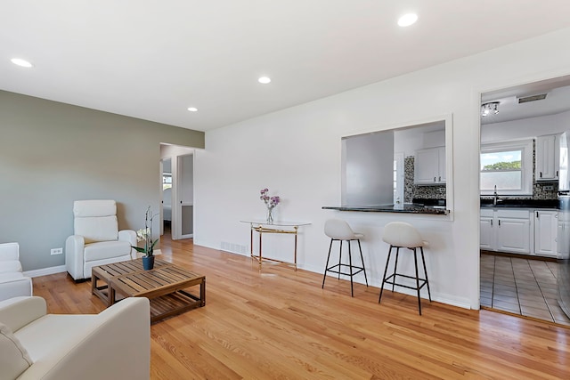 128 8th St, Downers Grove, IL 60515 - living room featuring light wood finished floors, recessed lighting, and baseboards