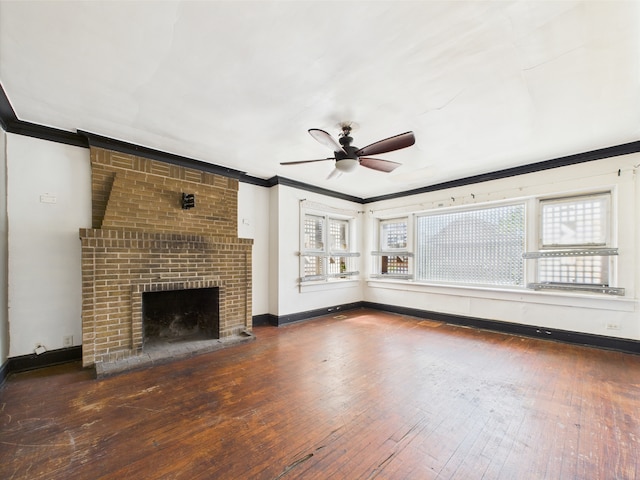 8237 S Ada St, Chicago, IL 60620 - unfurnished living room with crown molding, a ceiling fan, wood-type flooring, a brick fireplace, and baseboards