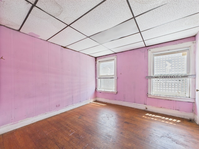 8237 S Ada St, Chicago, IL 60620 - empty room with a drop ceiling, hardwood / wood-style floors, and baseboards