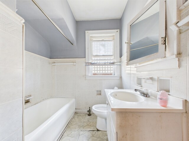 8237 S Ada St, Chicago, IL 60620 - full bath with tile walls, vanity, a bath, toilet, and marble look tiles