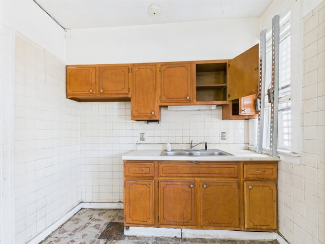 8237 S Ada St, Chicago, IL 60620 - kitchen with a sink, light countertops, brown cabinetry, open shelves, and tile walls