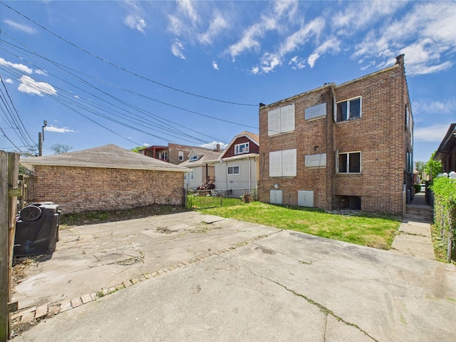 8237 S Ada St, Chicago, IL 60620 - rear view of house featuring a patio area and brick siding