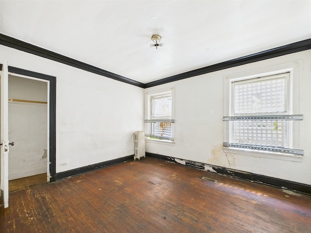 8237 S Ada St, Chicago, IL 60620 - empty room featuring crown molding, wood-type flooring, radiator, and baseboards