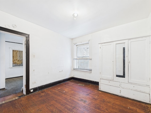 8237 S Ada St, Chicago, IL 60620 - unfurnished bedroom featuring dark wood-type flooring and baseboards