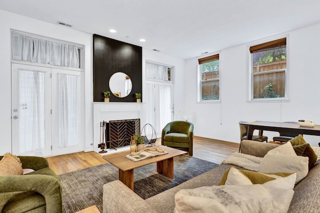 1947 W Evergreen Ave Unit A, Chicago, IL 60622 - living area featuring a fireplace, wood finished floors, recessed lighting, and baseboards