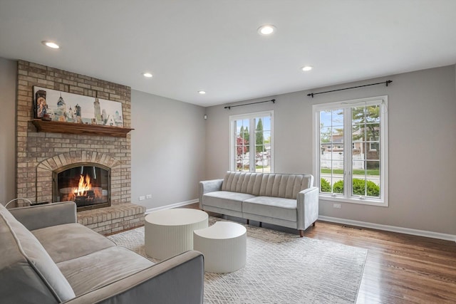 4647 N Thatcher Ave, Norridge, IL 60706 - living area featuring baseboards, wood finished floors, recessed lighting, and a fireplace