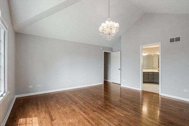 4647 N Thatcher Ave, Norridge, IL 60706 - unfurnished bedroom featuring a chandelier, high vaulted ceiling, dark wood-style floors, baseboards, and ensuite bathroom