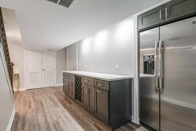 4647 N Thatcher Ave, Norridge, IL 60706 - kitchen with stainless steel refrigerator with ice dispenser, light wood-type flooring, light countertops, and baseboards