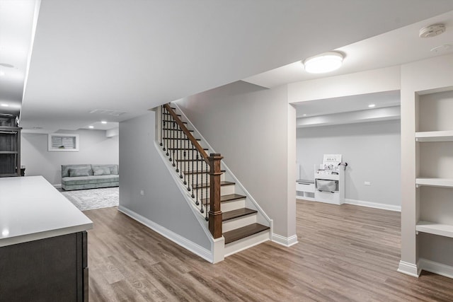 4647 N Thatcher Ave, Norridge, IL 60706 - stairs featuring wood finished floors, baseboards, built in shelves, and recessed lighting