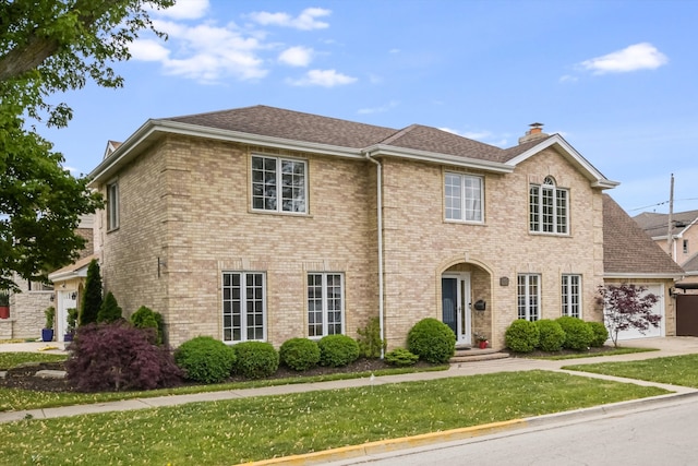 4647 N Thatcher Ave, Norridge, IL 60706 - view of front of home featuring a front yard, a garage, a chimney, brick siding, and a shingled roof
