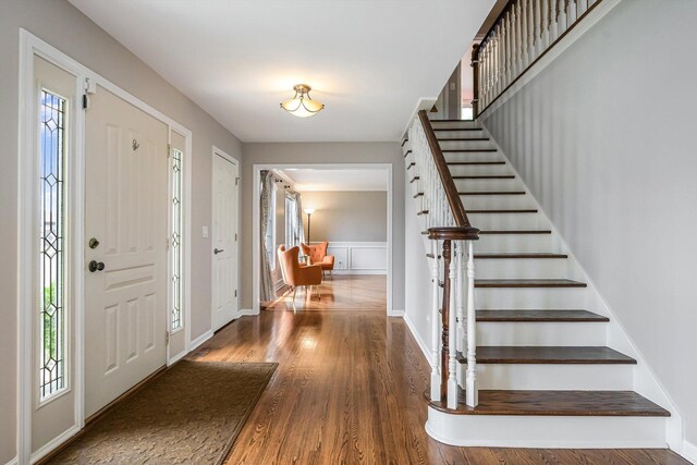 4647 N Thatcher Ave, Norridge, IL 60706 - entryway with stairs, wood finished floors, and baseboards
