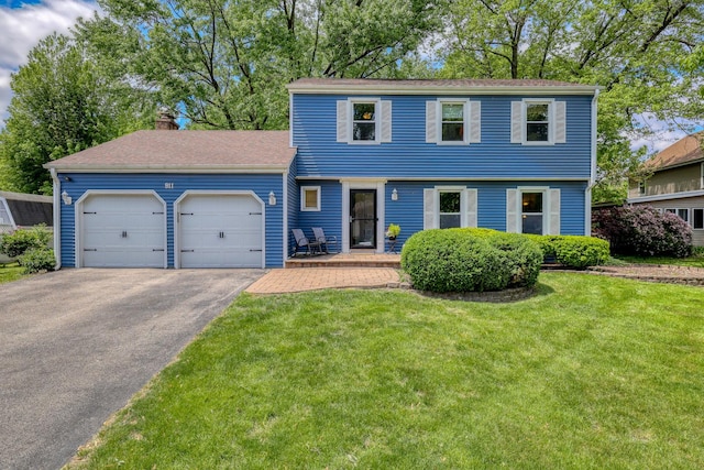 911 Woodland Hills Rd, Batavia, IL 60510 - colonial home featuring an attached garage, driveway, a chimney, and a front yard