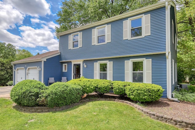 911 Woodland Hills Rd, Batavia, IL 60510 - colonial home with a garage and a front yard