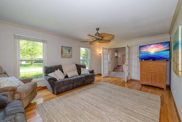 911 Woodland Hills Rd, Batavia, IL 60510 - living room with ornamental molding, stairs, baseboards, light wood-style floors, and ceiling fan