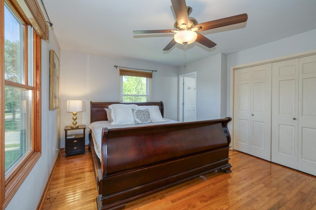 911 Woodland Hills Rd, Batavia, IL 60510 - bedroom featuring light wood finished floors, a closet, ceiling fan, and baseboards