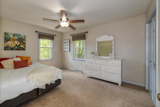 911 Woodland Hills Rd, Batavia, IL 60510 - bedroom featuring a closet, baseboards, light carpet, and ceiling fan