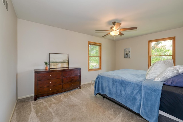 911 Woodland Hills Rd, Batavia, IL 60510 - bedroom featuring multiple windows, carpet flooring, baseboards, and ceiling fan