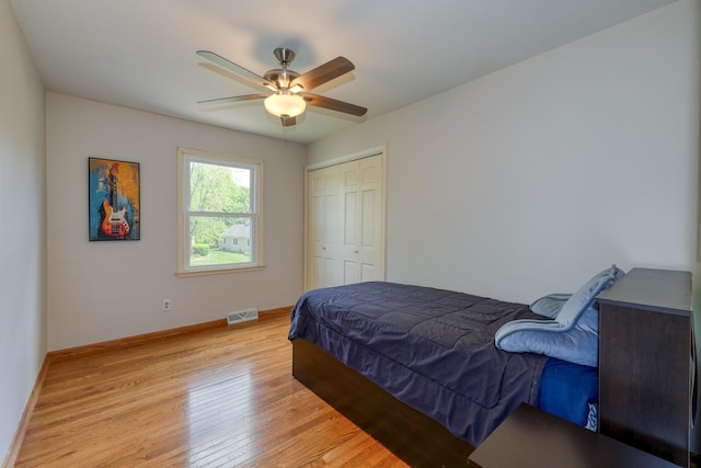 911 Woodland Hills Rd, Batavia, IL 60510 - bedroom with light wood finished floors, baseboards, a closet, and ceiling fan
