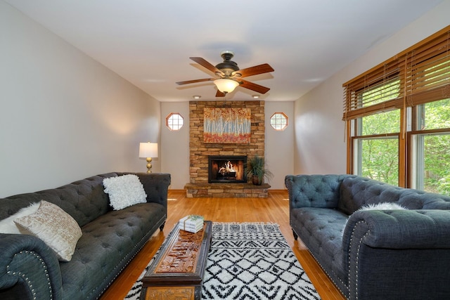 911 Woodland Hills Rd, Batavia, IL 60510 - living room with healthy amount of natural light, light wood-type flooring, ceiling fan, and a fireplace