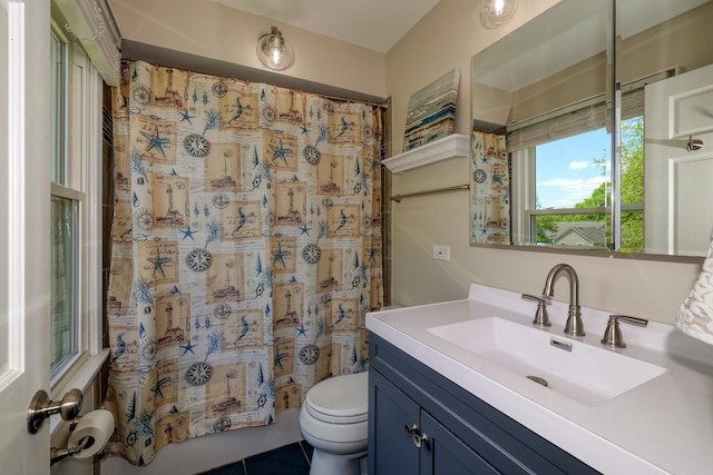 911 Woodland Hills Rd, Batavia, IL 60510 - bathroom with toilet, vanity, and tile patterned flooring
