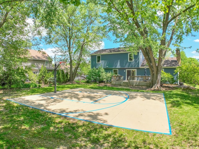 911 Woodland Hills Rd, Batavia, IL 60510 - view of sport court featuring basketball hoop and a yard