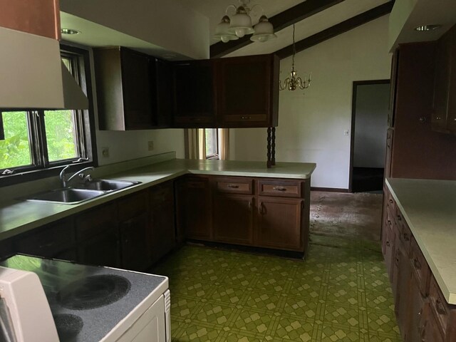4528 1369th Rd, Earlville, IL 60518 - kitchen featuring stove, a sink, a chandelier, lofted ceiling, and tile patterned floors