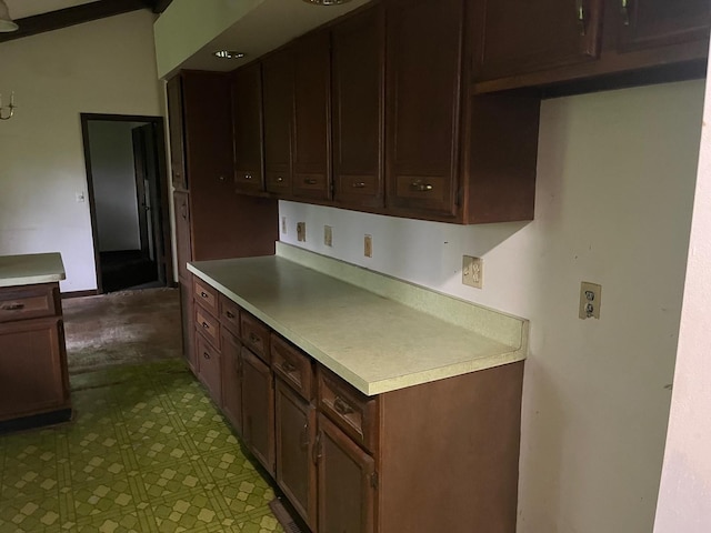 4528 1369th Rd, Earlville, IL 60518 - kitchen with light countertops, tile patterned floors, and dark brown cabinetry