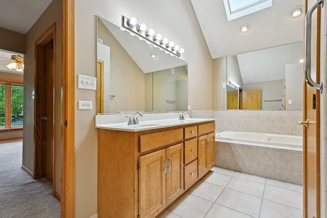 22178 Chamomile Dr, Frankfort, IL 60423 - full bathroom featuring a skylight, double vanity, vaulted ceiling, tile patterned floors, and a relaxing tiled tub